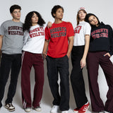 Group of five people wearing Roberts Wesleyan merch