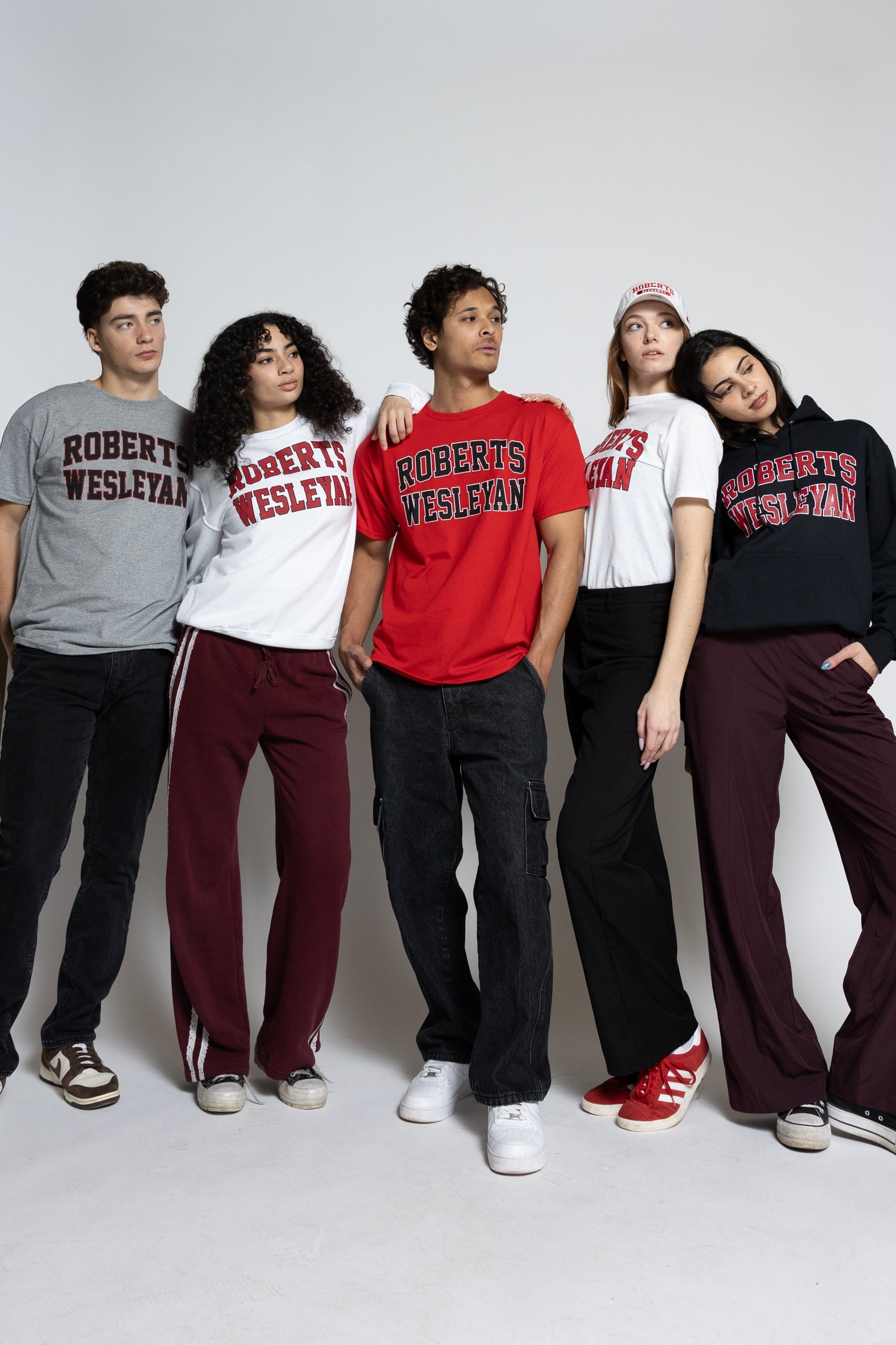 Group of five people wearing Roberts Wesleyan merch